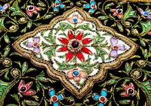 Load image into Gallery viewer, Small silk embroidered floral tapestry, multicolor silk flowers embroidered on black velvet in a carpet pattern, zardozi carpet tapestry, close up view.
