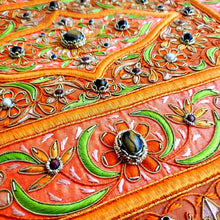 Load image into Gallery viewer, Embroidered jewel carpet wall hanging in orange floral pattern and tiger eye stones, embroidered orange silk flowers on orange velvet, zardozi tapestry, close up view.
