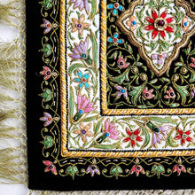 Load image into Gallery viewer, Small silk embroidered floral tapestry, multicolor silk flowers embroidered on black velvet in a carpet pattern, zardozi carpet tapestry, view of border.