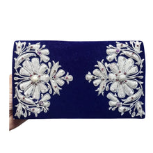 Load image into Gallery viewer, Cobalt blue velvet luxury evening clutch bag embroidered with two large flowers in white silver and embellished with genuine gemstones, floral wedding clutch, blue and silver zardozi purse.
