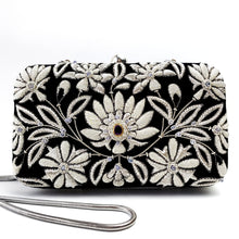 Load image into Gallery viewer, Black velvet minaudiere clutch embroidered with silver and white lotus flowers and inlaid with amethyst gemstone BoutiqueByMariam.

