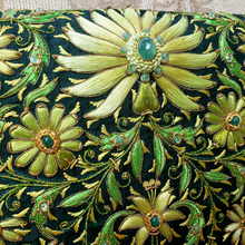 Load image into Gallery viewer, Exclusive green silk designer evening bag with chain, hand embroidered with bright green flowers and inlaid with emeralds, zardozi work, close up view. 
