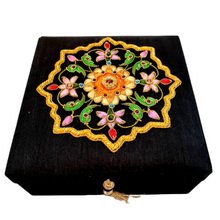 Load image into Gallery viewer, Luxury black silk jewelry storage box, keepsake box, embroidered with orange flowers and embellished with ruby and emerald gemstones. 
