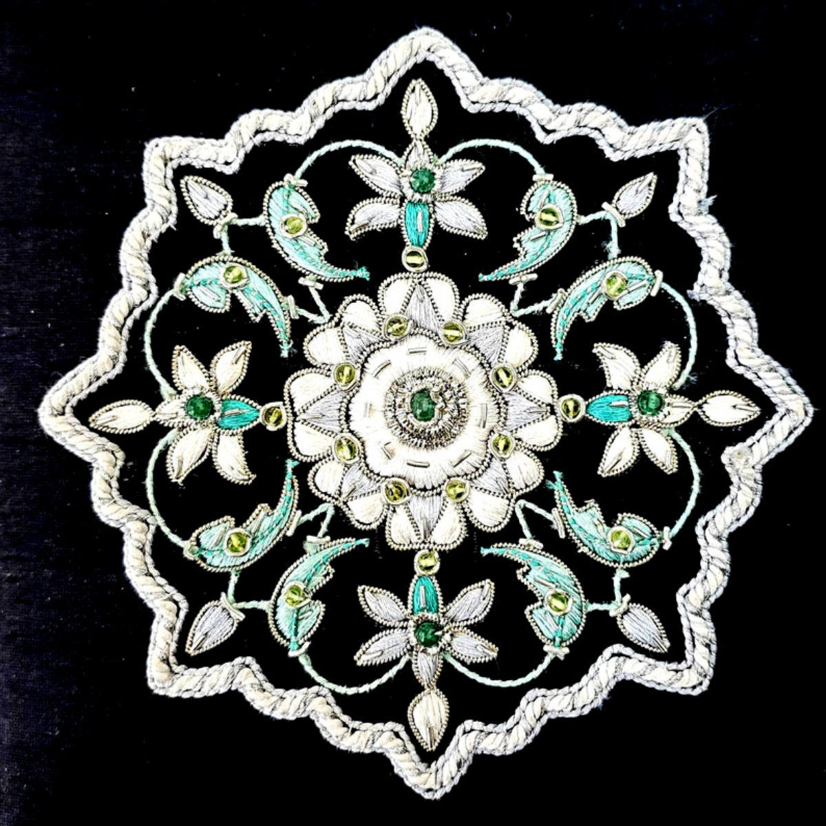 Luxury black silk jewelry box, jewelry storage box embroidered with white flower and emerald cabochon, zardozi box., close up view. 