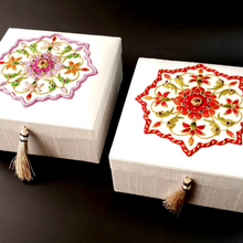 Load image into Gallery viewer, Two hand embroidered white silk wedding memory boxes, one with red flowers, the other with pink flowers.
