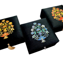 Load image into Gallery viewer, Three decorative embroidered floral boxes in black silk, with semi precious stones.
