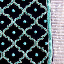 Load image into Gallery viewer, Luxury black velvet crossbody bag hand embroidered with turquoise geometric pattern and inlaid with turquoise stones, close up view.
