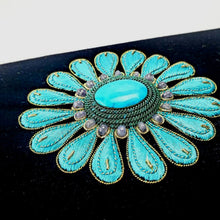 Load image into Gallery viewer, Hand embroidered turquoise blue silk flower on a black velvet minaudiere clutch bag inlaid with turquoise stone and aqua chalcedony gemstones, close up view. 
