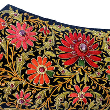 Load image into Gallery viewer, Luxury black silk evening clutch bag embroidered with gold work and red silk flowers and embellished with ruby gemstones, zardozi bag, close up view. 
