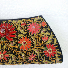 Load image into Gallery viewer, Exclusive black silk clutch bag hand embroidered with red silk flowers on both sides and inlaid with ruby gemstones, zardozi.

