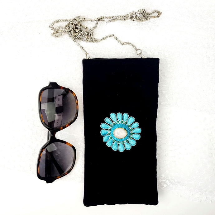 Luxury black velvet crossbody bag embroidered with turquoise blue flower and inlaid with moonstone and malachite gemstones.