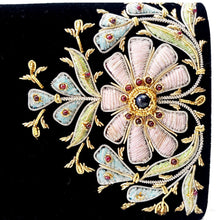 Load image into Gallery viewer, Designer embroidered black velvet bag with pink flowers and inlaid with lapis lazuli and garnet gemstones, close up view. 
