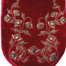 Load image into Gallery viewer, Designer red velvet slim crossbody bag embroidered with antique gold flowers and vines and embellished with semi precious stones, zardozi work., close up view. 
