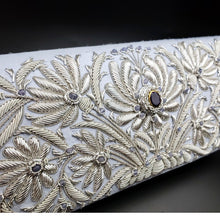Load image into Gallery viewer, Luxury pale blue silk wedding clutch hand embroidered with silver flowers and inlaid with amethyst, zardozi work, side view.
