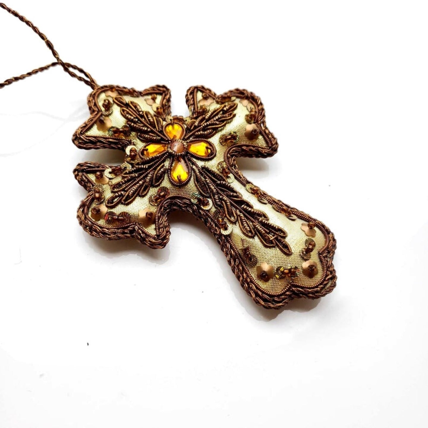 Hand embroidered gold cross hanging ornament.