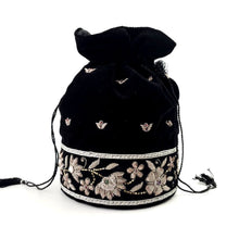 Load image into Gallery viewer, Luxury black velvet bucket bag embroidered with silver colored flowers. 
