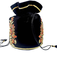 Load image into Gallery viewer, Luxury black velvet potli bag for Indian wedding, hand embroidered with red and gold flowers, zardozi purse, side view. 
