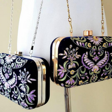 Load image into Gallery viewer, Two formal navy velvet small clutch bags embroidered with silk purple flowers, gold tone or silver tone hardware. 
