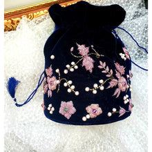 Load image into Gallery viewer, Luxury hand embroidered navy blue velvet potli bag or drawstring pouch bag embroidered with pink metallic flowers, zardozi potli bag.
