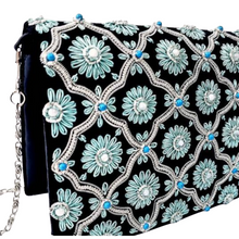 Load image into Gallery viewer, Black silver clutch bag with blue flowers and turquoise stones, side view. 
