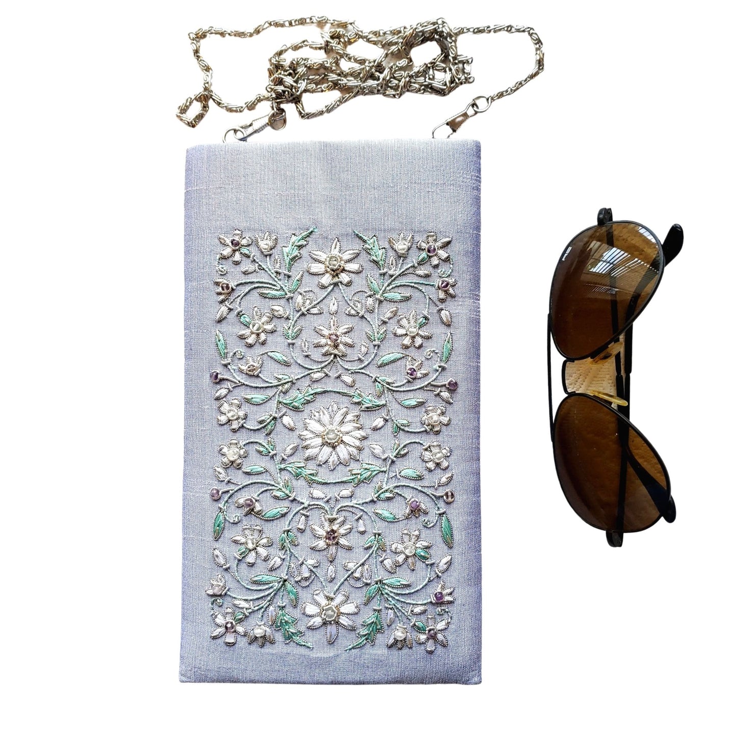Gray lavender soft eyeglasses case embroidered with white flowers. 