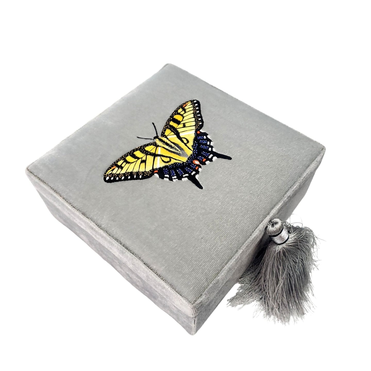 Hand embroidered yellow swallowtail butterfly on gray velvet decorative box. 