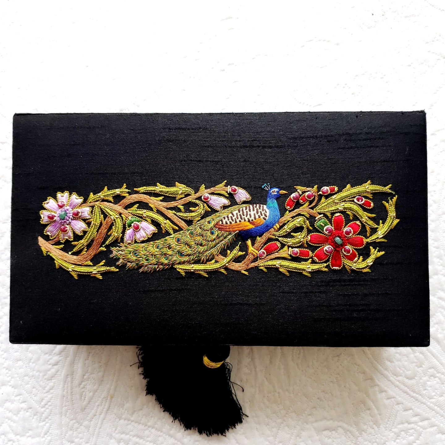 Luxury black silk jewelry storage box embroidered with peacock and inlaid with gemstones.