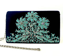 Load image into Gallery viewer, Luxury black velvet evening clutch bag embroidered with teal colored daisy flowers, zardozi purse. 

