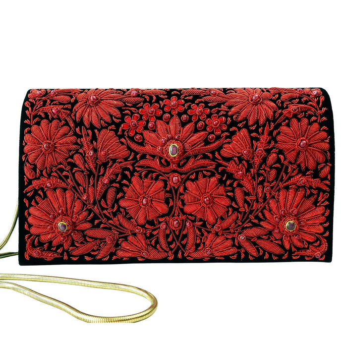 Luxury red metallic clutch bag embroidered with ruby gemstones. 
