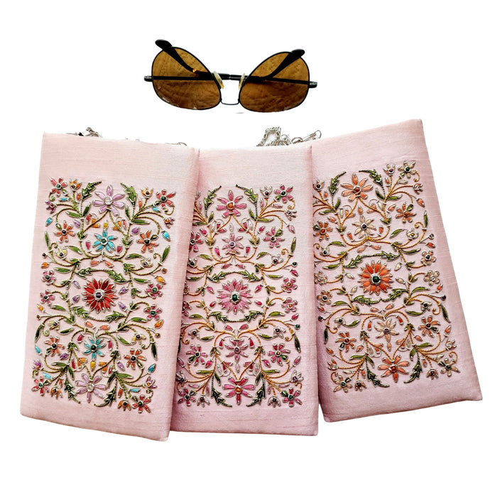 Three pastel pink silk slim eyeglasses cases with chain hand embroidered with multicolor flowers.