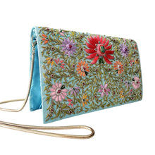 Load image into Gallery viewer, Turquoise blue handbag embroidered with coral lotus flower, side view, BoutiquebyMariam. 
