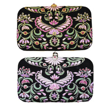 Load image into Gallery viewer, Two black velvet embroidered minaudiere, top one pink flowers with gold outline, bottom one lavender flowers with silver lining BoutiqueByMariam. 
