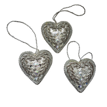 Load image into Gallery viewer, Set of two hand embroidered silver heart hanging ornaments. 
