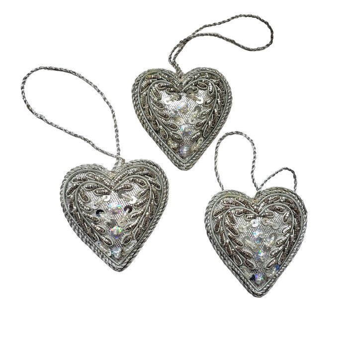 Set of two hand embroidered silver heart hanging ornaments. 