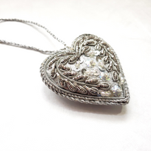 Load image into Gallery viewer, Silver hand embroidered heart ornament, side view. 
