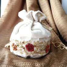 Load image into Gallery viewer, White cream velvet drawstring pouch bag embroidered with red and orange flowers, zardozi purse.
