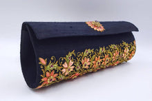 Load image into Gallery viewer, Hand embroidered luxury black silk clutch bag in an orange floral pattern all over and embellished with rubies, zardozi purse, side view.
