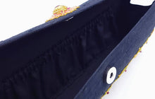 Load image into Gallery viewer, Interior of black silk clutch showing gathered full length pocket. and snap closure.
