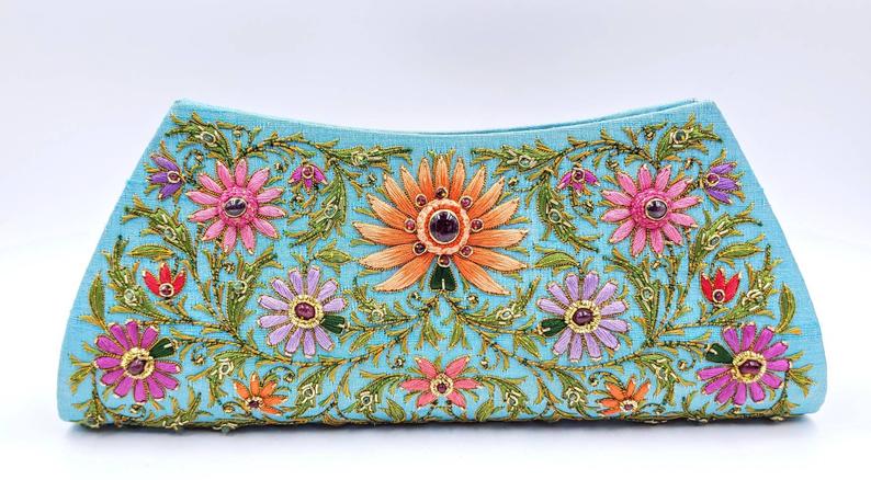 Turquoise blue clutch embroidered with multicolor flowers and embellished with star rubies, zardozi purse