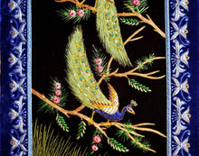 Load image into Gallery viewer, Embroidered wall art, embroidered silk and velvet tapestry of two peacocks with blue border, zardozi wall art, close up view.

