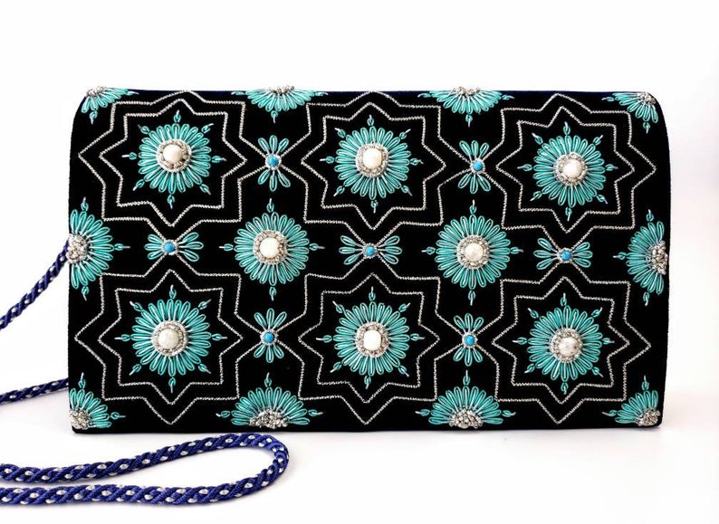 Navy blue velvet clutch bag embroidered with silver and teal art deco inspired design and embellished with semi precious stones, zardozi evening bag, cord strap. 