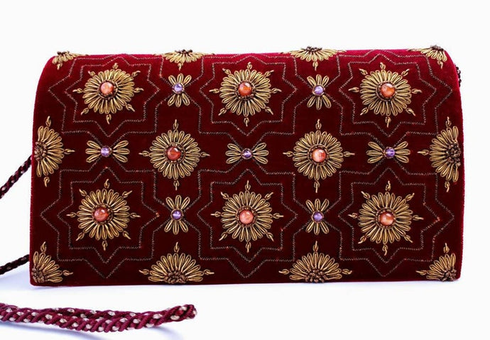 Burgundy velvet clutch embroidered with copper metallic medallions and embellished with semi precious stones, zardozi evening bag, cord strap. 