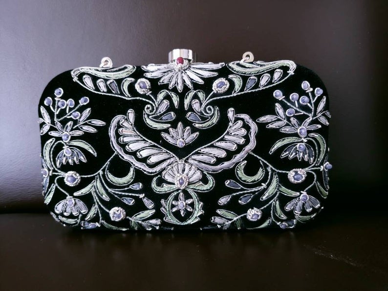 Black velvet minaudiere box clutch bag with gray floral embroidery and blue chalcedony stones. 
