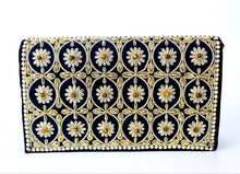 Load image into Gallery viewer, Luxury black velvet clutch bag embroidered with goldwork and embellished with tiger eye stones., zardozi purse.e and faux pearls. 
