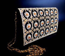 Load image into Gallery viewer, Black velvet clutch bag embroidered with gold tone metallic threads and with genuine onyx and faux pearls, side view. 
