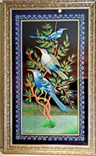 Load image into Gallery viewer, Embroidered bird wall art, three bluebirds in a tree embroidered in silk on black velvet with ornate border, framed, zardozi art. 
