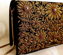 Load image into Gallery viewer, Luxury black velvet zardozi clutch bag with copper metallic thread embroidery and star ruby, goldtone shoulder strap, side view
