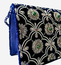 Load image into Gallery viewer, Luxury navy blue velvet clutch bag embroidered with silver flowers and embellished with green onyx and garnet stones, cord strap, zardozi evening bag, side view. 
