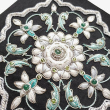 Load image into Gallery viewer, Luxury black silk jewelry storage box, trinket box embroidered with white and gray central floral medallion and emerald stone, zardozi box, close up view. 
