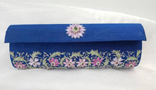 Load image into Gallery viewer, Blue Silk clutch bag embroidered with pink flowers and embellished with emerald and star rubies, zardozi purse. 
